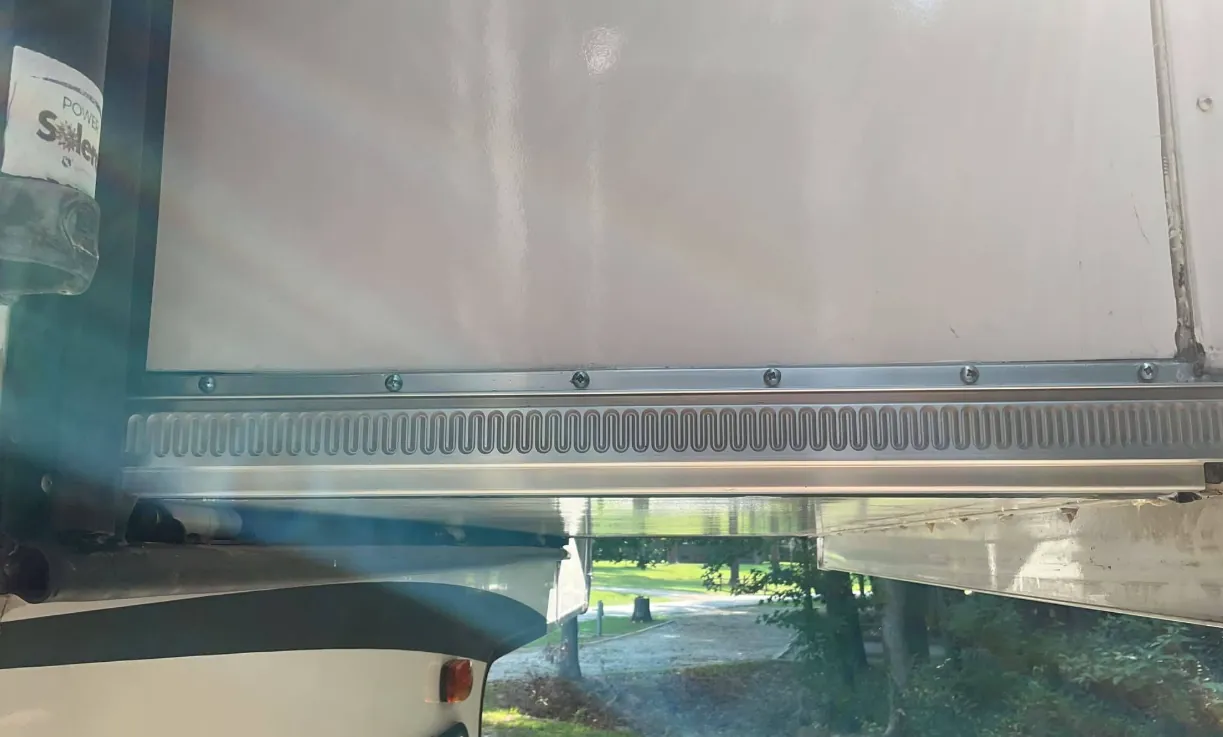 Lippert through-frame hydraulic slide on an RV in Florida
